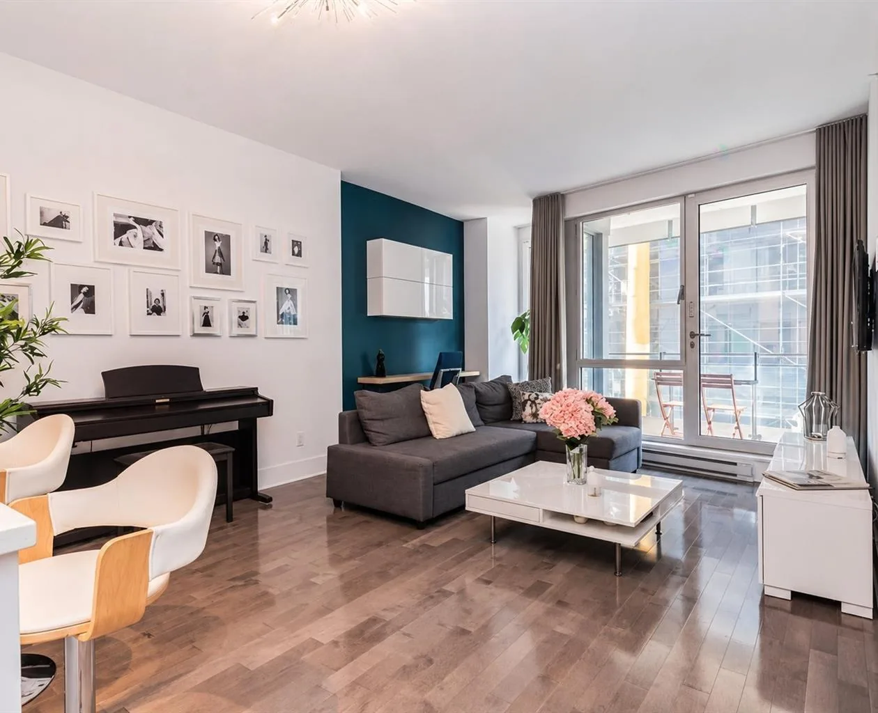 Le Solano condominium living room in Old Montréal, with sliding balcony doors