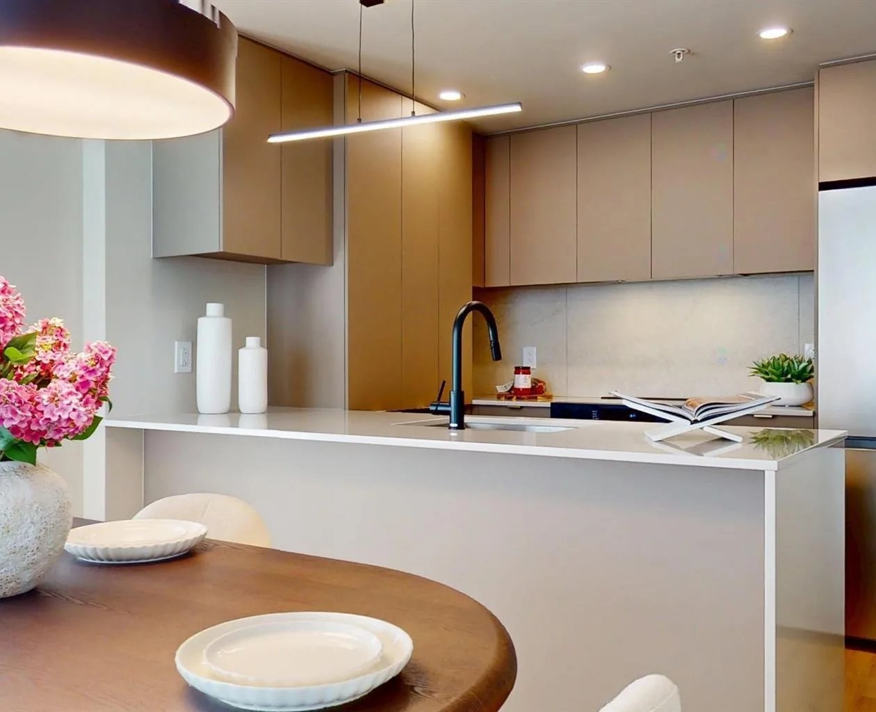Sorella residence at 1555 Chomedey in Laval, with a wood-finished kitchen and island