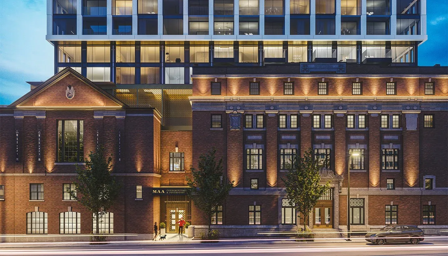 MAA Condos & Penthouses in downtown Montréal, with an illuminated historic façade