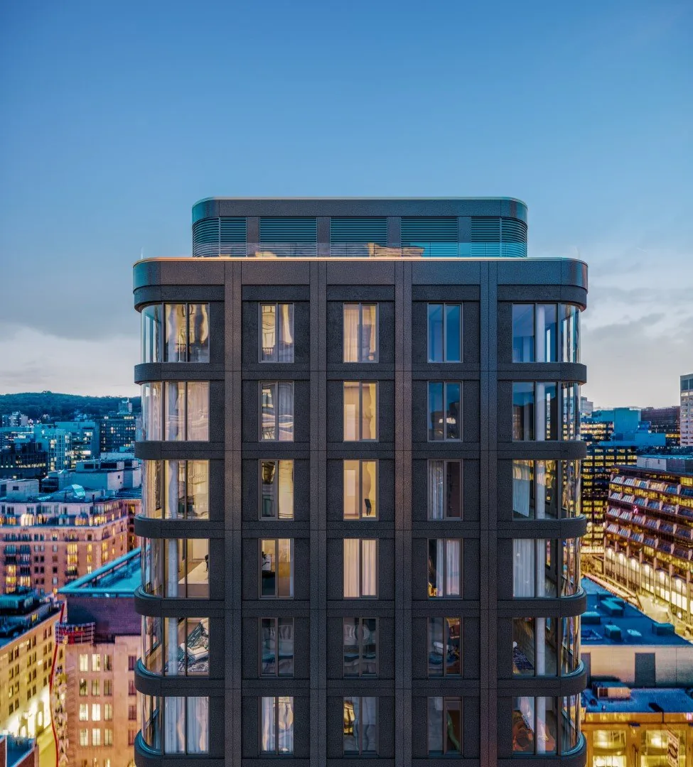Mansfield condominium tower in downtown Montréal, with a dark masonry façade