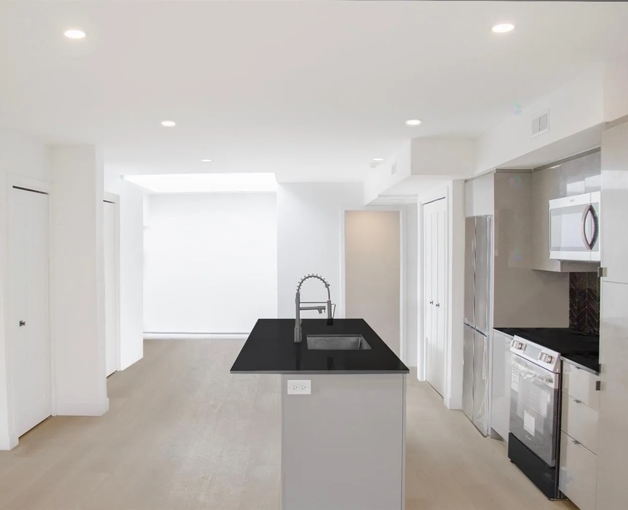 Renovated kitchen at 5350 Avenue Victoria in Côte-des-Neiges, with a stone island